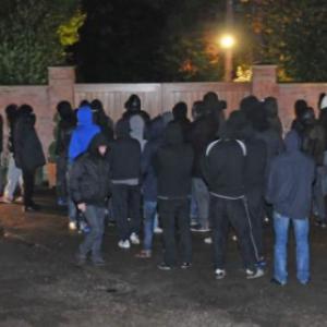Wayne Rooney under fire: Mob of Manchester United fans gather outside house
