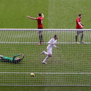 United draw with Swansea but lead the table at Christmas
