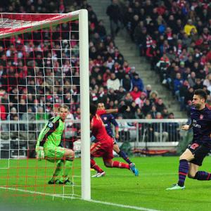 Arsenal win but bow out
