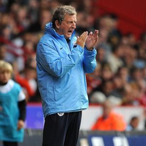 Hodgson backs players after rout