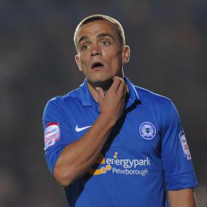 Footballer charged in brawl probe