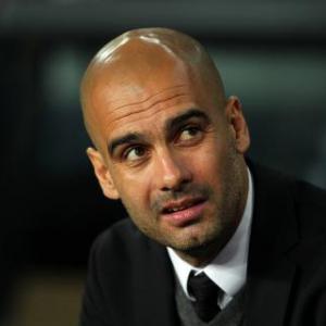 Berlusconi admits AC Milan are chasing Guardiola
