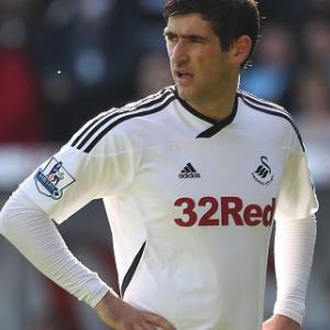Graham treble spurs Swans