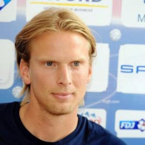 Danish football skipper Poulsen retires
