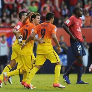 Messi double saves Barcelona